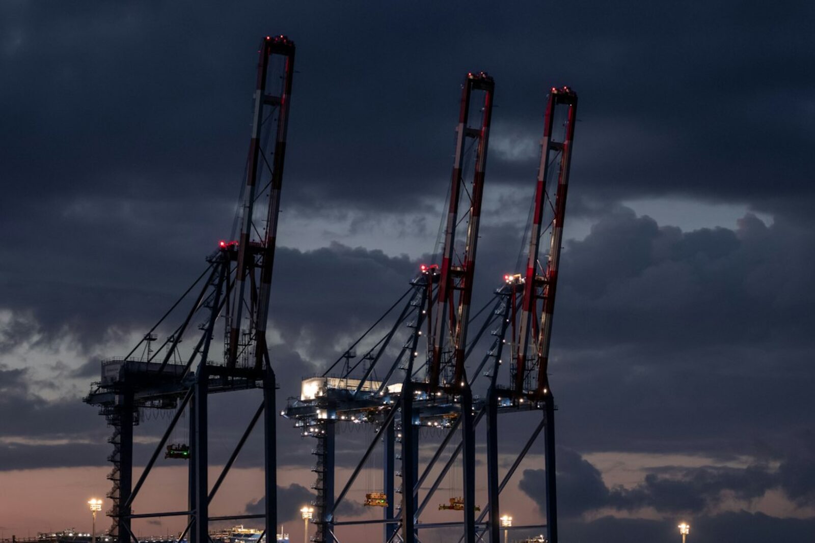 Ship-to-shore gantry cranes at dusk