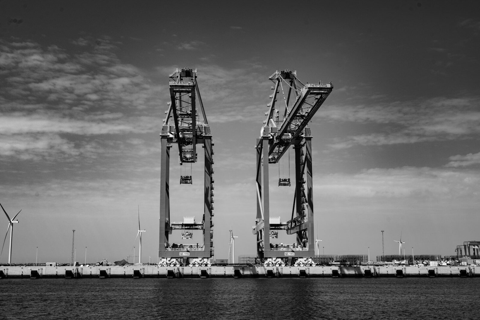 Gantry crane handling containers in maritime logistics operations